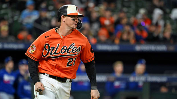 Oct 8, 2023; Baltimore, Maryland, USA; Baltimore Orioles left fielder Austin Hays (21) hits a single during the ninth inning against the Texas Rangers during game two of the ALDS for the 2023 MLB playoffs at Oriole Park at Camden Yards.